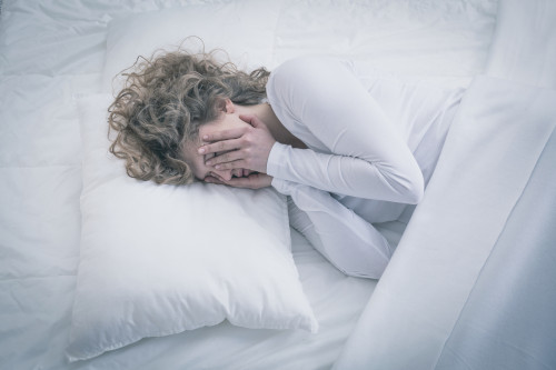 Picture of depressed woman sleeping all day