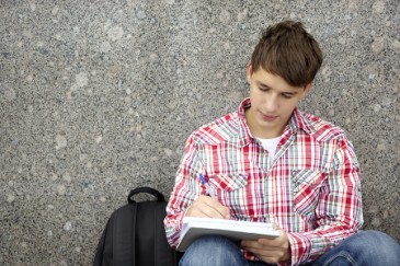 high_school_boy_writing_essay_H