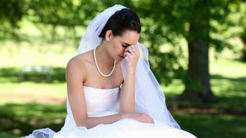 stock-footage-upset-bride-crying-on-a-sunny-day